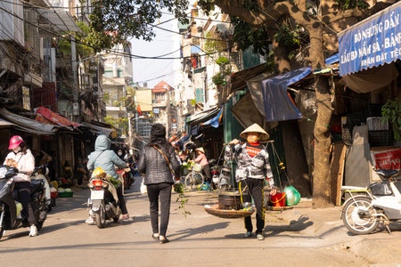 Hanoi, Vietnam, January 2023. panoramic view of the traditional food vendors on the street in the city center.のeditorial素材