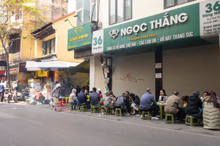 Hanoi, Vietnam, January 2023. a traditional open air sidewalk restaurant in the city centreのeditorial素材