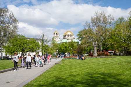 Sofia, Bulgaria. May 2023. St. Kl. Ohridski gardens with the domes of Alexander Nevsky Cathedral in the backgroundのeditorial素材