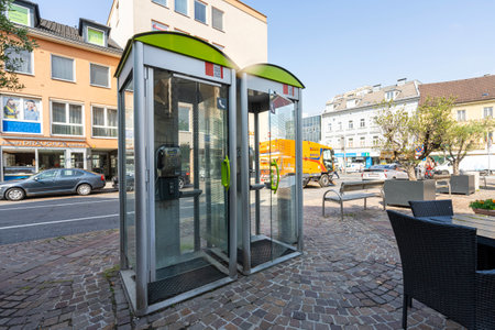 Villach, Austria. July 18 2023. telephone booths in a city center squareのeditorial素材