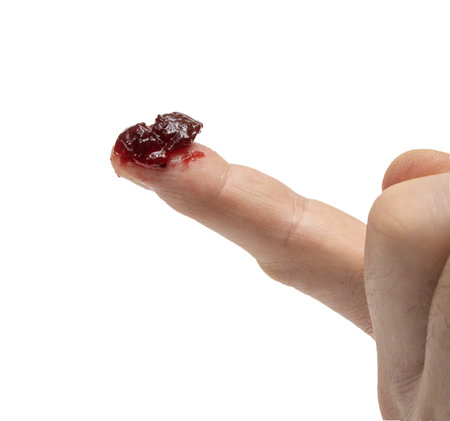 berry jam on the tip of a finger on a transparent background