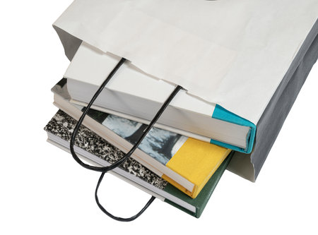 some books inside a white paper bag on a transparent backgroundの写真素材