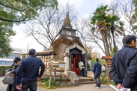 Tokyo, Japan. January 2024. faithful visiting the gardens of the Yakushido Pagoda Buddhist temple at Ueno park in the city centerのeditorial素材