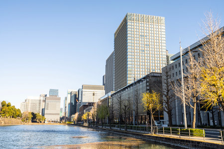 Tokyo, Japan. January 8, 2024. the water canal in the Front Gardens of the Imperial Palace with the modern skyscrapers of the city center in the backgroundのeditorial素材