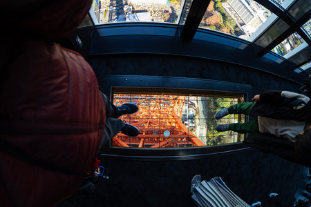 Tokyo, Japan. January 9, 2024. Impressive view of the glass window on the floor of the Tokyo Tower observatory deckのeditorial素材