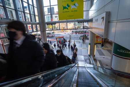 Tokyo, Japan. January 9, 2024. people going up an escalator in a shopping center in the city centerのeditorial素材