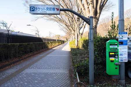 Tokyo, Japan. January 2024. a parking meter in a city center streetのeditorial素材