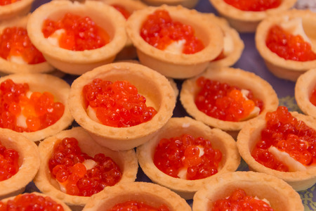 Tartlets with red caviar