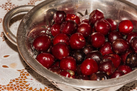 cooking cherry jam on a gas stove in the villageの写真素材