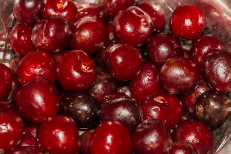 cooking cherry jam on a gas stove in the villageの写真素材