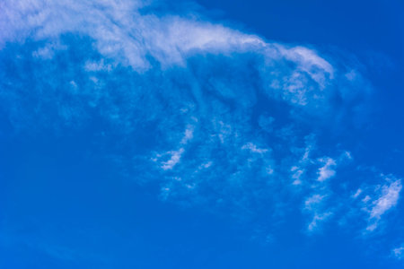 Beautiful blue sky with white clouds curly