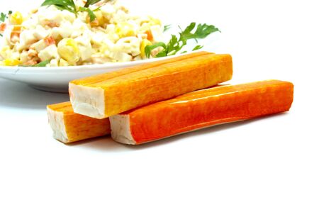salad from fish sticks is photographed on a white backgroundの写真素材