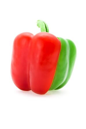 the cut red and green pepper also is difficult by strips in a single whole, is photographed on a white backgroundの写真素材