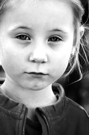 the black-and-white photo of the little girl was made on walkの写真素材