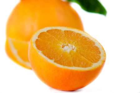 beautiful, ripe oranges are photographed on a white background