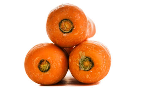big ripe carrots were photographed in studio on a white backgroundの写真素材