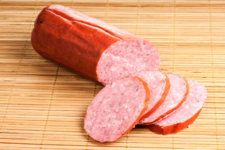 beautiful smoked sausage was photographed in studio on a white background