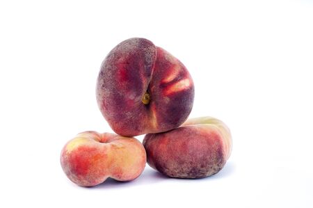 the beautiful juicy ripe peach was photographed on a white backgroundの写真素材