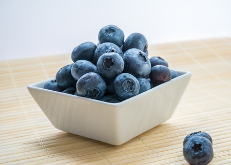 fresh blueberry was beautiful is photographed in a plate in studioの写真素材