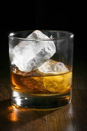 Beautiful cold whiskey with ice was photographed in the studioの写真素材
