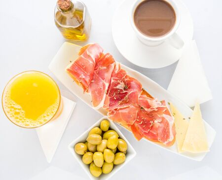 Delicious breakfast toast with hamon orange juice and olivesの写真素材