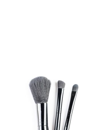 Different makeup brushes were photographed against a white backgroundの写真素材