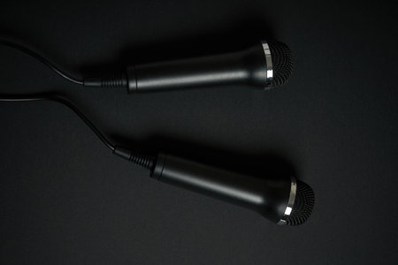 Black microphone on black backgroundの写真素材