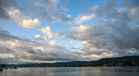 panoramic view of the lake of zurich on a cloudy morningの写真素材