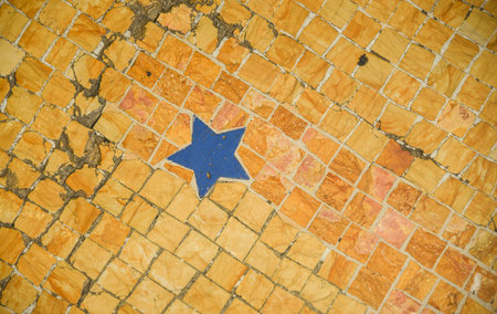 Blue star tile on the floor in Milano, Italyの写真素材