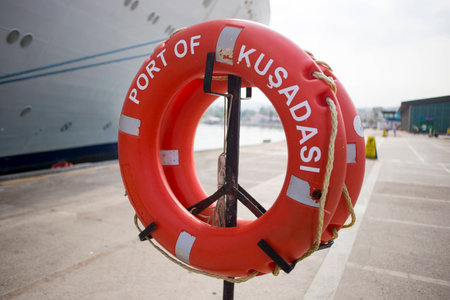 Orange lifebuoy stay in portの写真素材