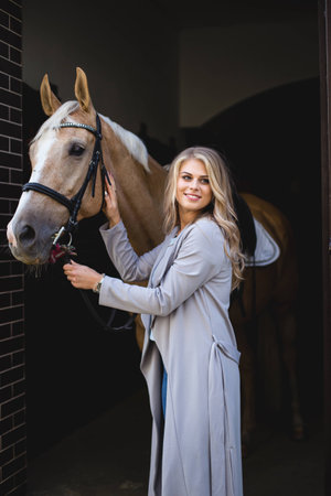 beautiful young girl and a horse, portrait, summerの写真素材