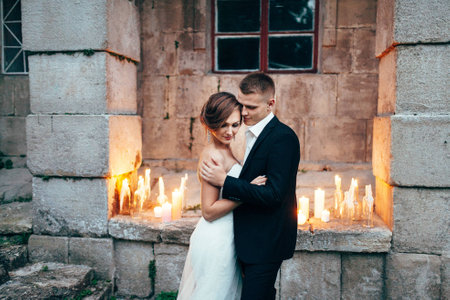 young beautiful wedding couple and huggingの写真素材