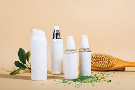 Cosmetic bottle containers with green herbal leaves, Blank label for branding mock up, Natural beauty product concept. Color Processedの写真素材