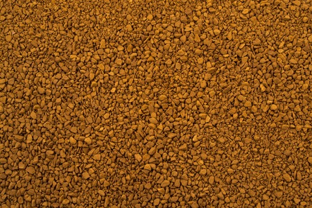Granules of instant aromatic brown coffee background.の写真素材