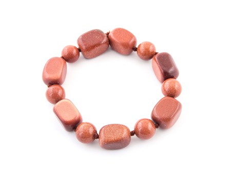 mineral gem stone Aventurine - orange brown gemstone isolated on white background.