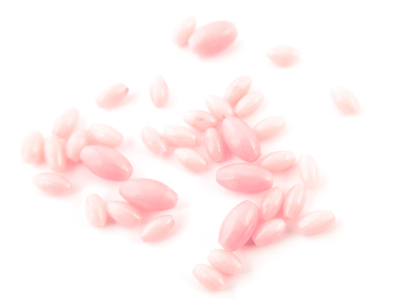 Natural gemstone pink coral beads on a white background.