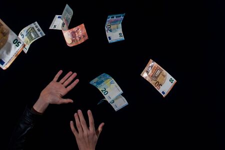 Taking money that falls from the sky flying bills at night