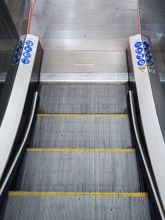 going down escalators at the mall