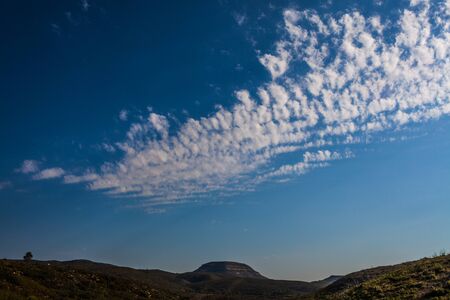 Motroton mountain with blue sky and white windy clouds