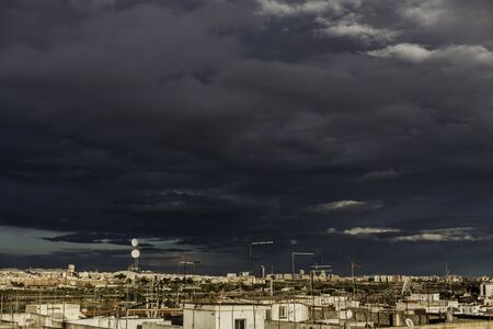Cloudy stormy sky over the city with rain clouds