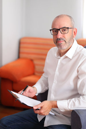 The consultant uses a notebook to capture key insights in a serene office, ensuring focused and...
