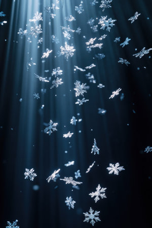 Snowflakes illuminated by light beams in a dark atmospheric setting.の素材