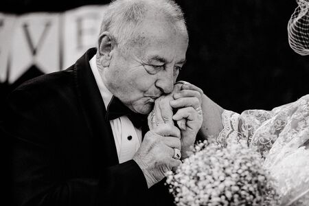 forever in love concept. wedding anniversary decoration. elder couple wedding portrait. love in age. wedding concept. old bride and groom. fifth golden wedding anniversary. everlasting true love.の写真素材