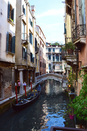 Typical Venice canal with boats and bridge in the bottom, Italy summer 2016のeditorial素材
