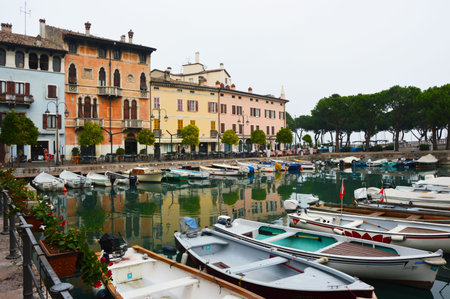 Desenzano del Garda view on the marina port, harbor view with boats, with nice view on building venetian style, november 2016, Italyのeditorial素材