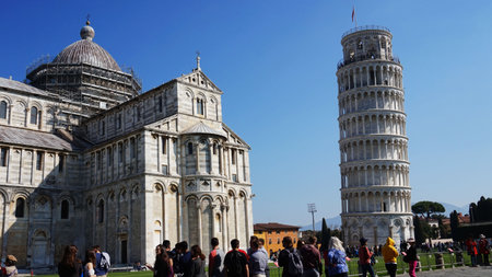 Leaning Tower and Cathedral of Santa Maria Assunta in Piazza dei Miracoli also known as Piazza del Duomo with tourists, Pisa, Italyのeditorial素材