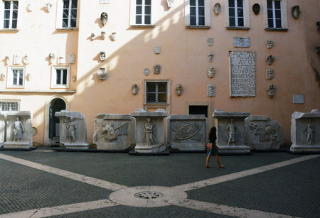 Tourist looking at antique works of art in the courtyard of Capitoline Museum. Capitoline Hill - one of the hills of ancient Rome.のeditorial素材