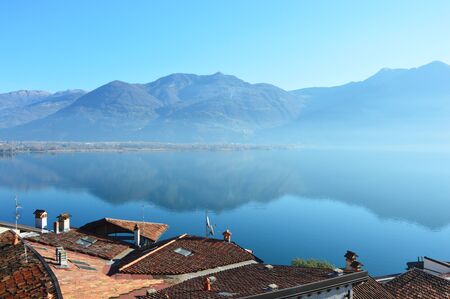 Mountain view with reflection, Lake Iseo, Lovere town, Italyの写真素材