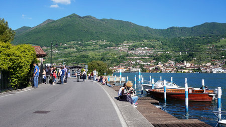 MONTE ISOLA, ITALY - MAY 13, 2017: Central Street and harbor of Peschiera Maraglio on the island of Monte Isola, Lake Iseo, Italyのeditorial素材