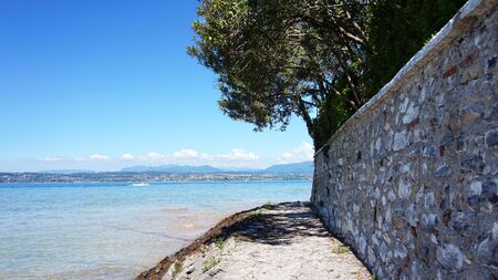 Great view of Lake Garda from Sirmione beach, Italyの写真素材